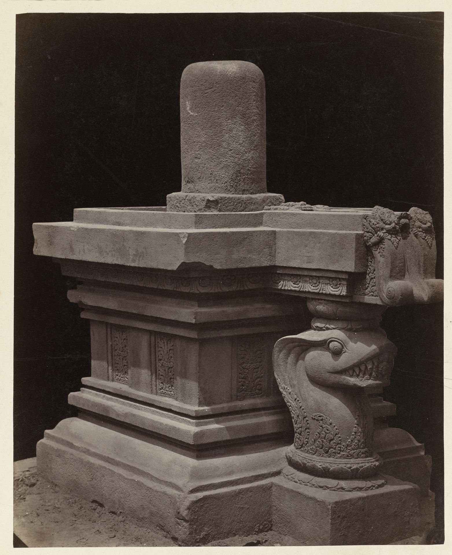 Yoni strutted by a naga, topped bij a non-contextual llinga (former Lichte collection). Yogyakarta, Yogyakarta district, D.I. Yogyakarta province, 9th century. by Isidore Kinsbergen
