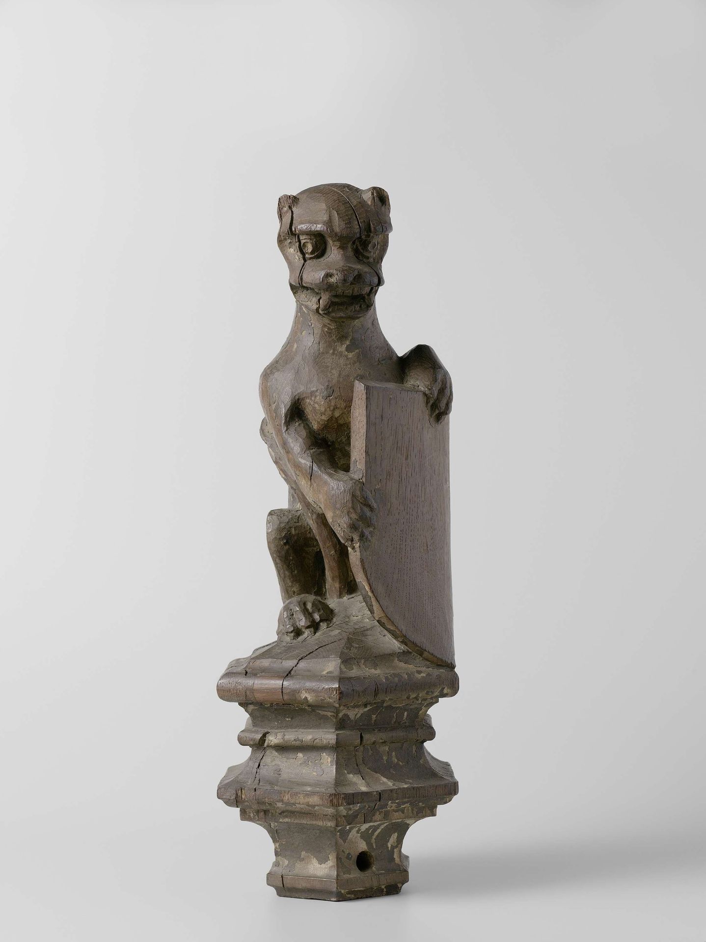 Ape-like Creature Supporting an Escutcheon, from the Top of a Balustrade or the Backrest of the Stadholder’s Chair in the Rolzaal in the Hof van Holland, The Hague by Joost Janszoon