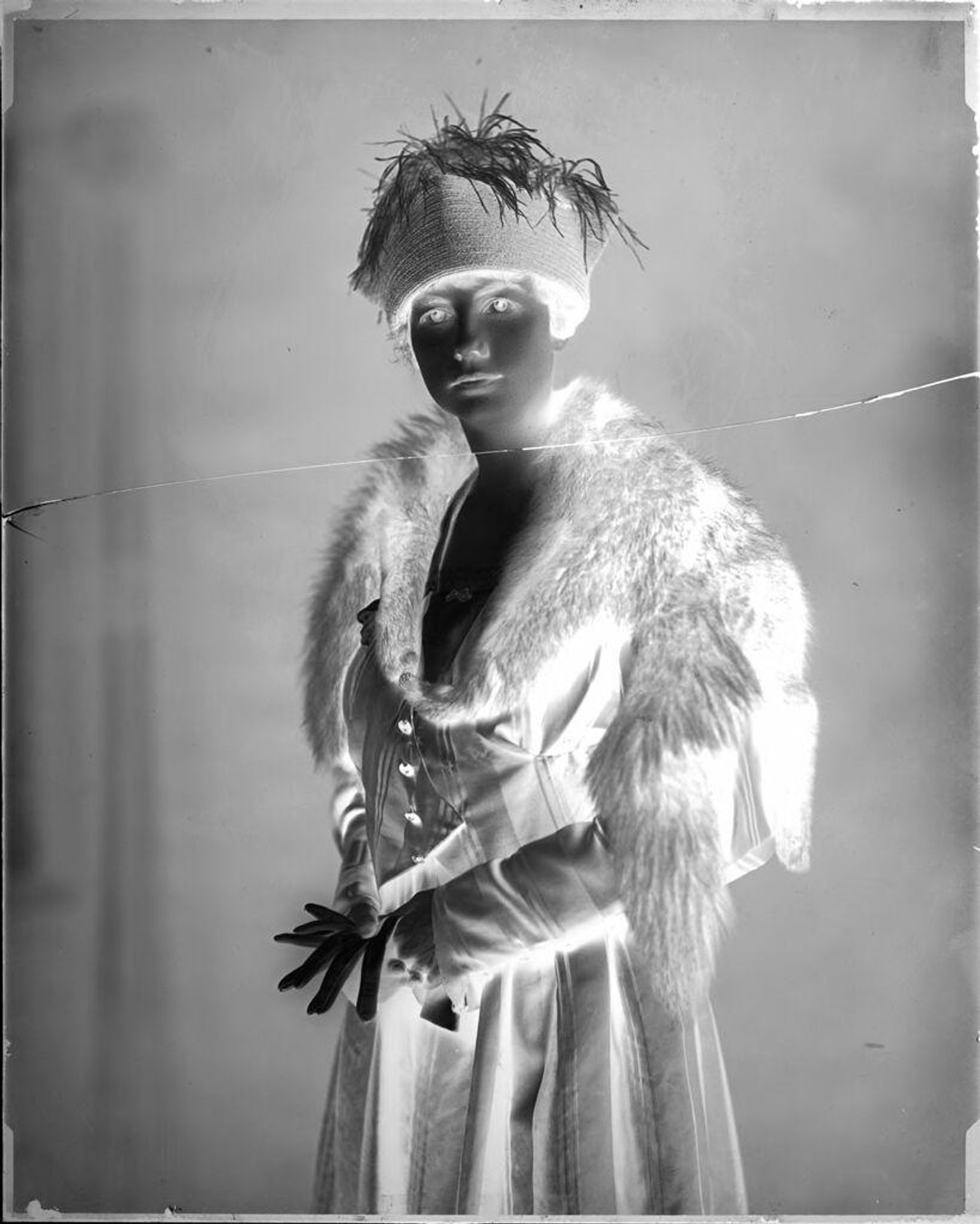 Untitled (portrait of woman with fur stole and feathered hat) by Hamblin Studio