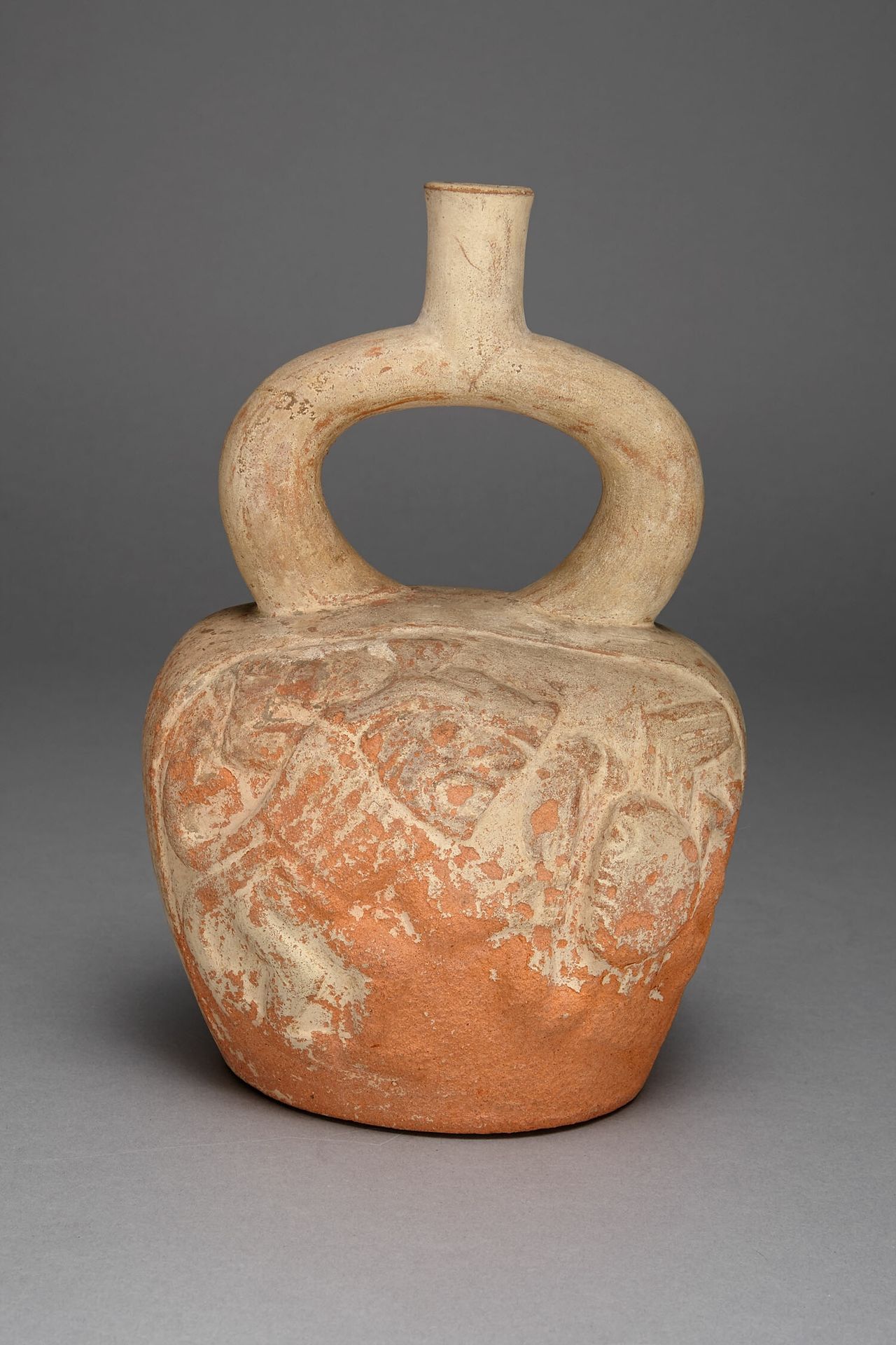 Stirrup Spout Vessel with Relief Depicting a Figure and Crab in Battle by Moche