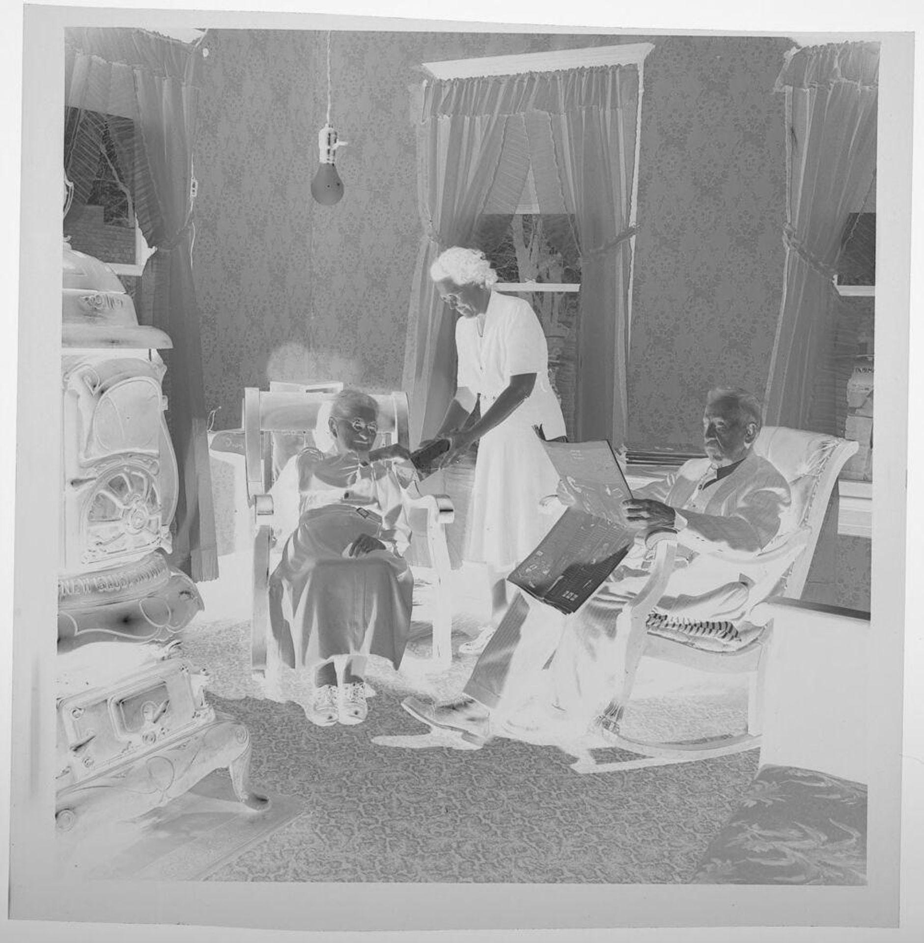 Untitled (woman standing with two elderly people in rocking chairs) by Jack Gould