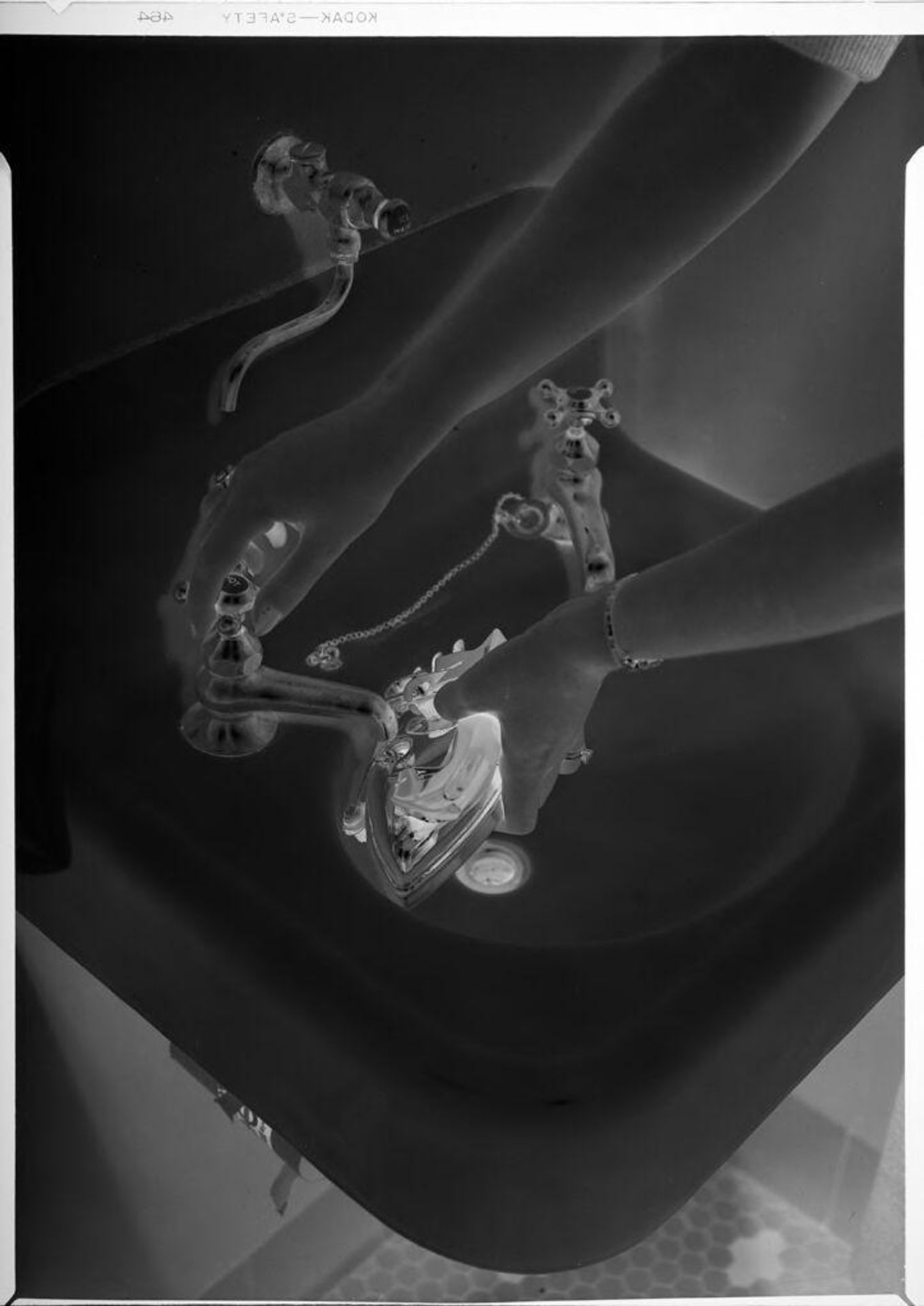Untitled (hands filling steam iron in sink) by Robert Burian