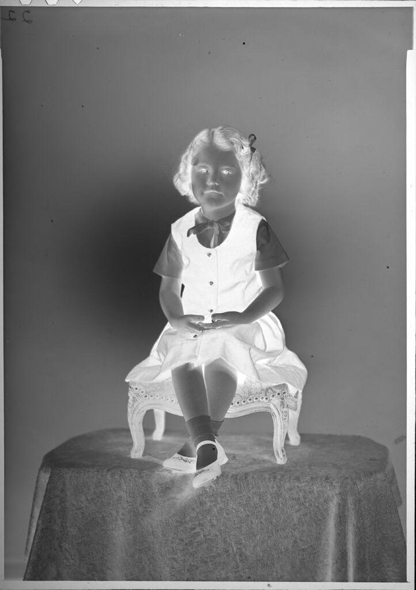 Untitled (portrait of little girl on stool) by C. Bennette Moore