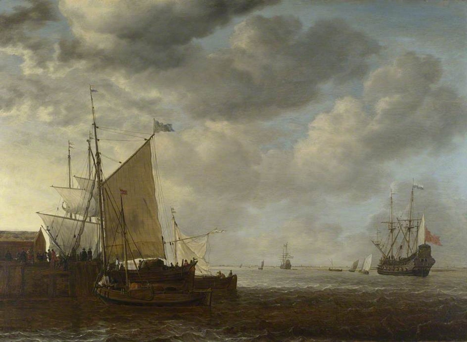 A View of An Estuary with Dutch Vessels at a Jetty and a Dutch Man of War at Anchor by Simon de Vlieger