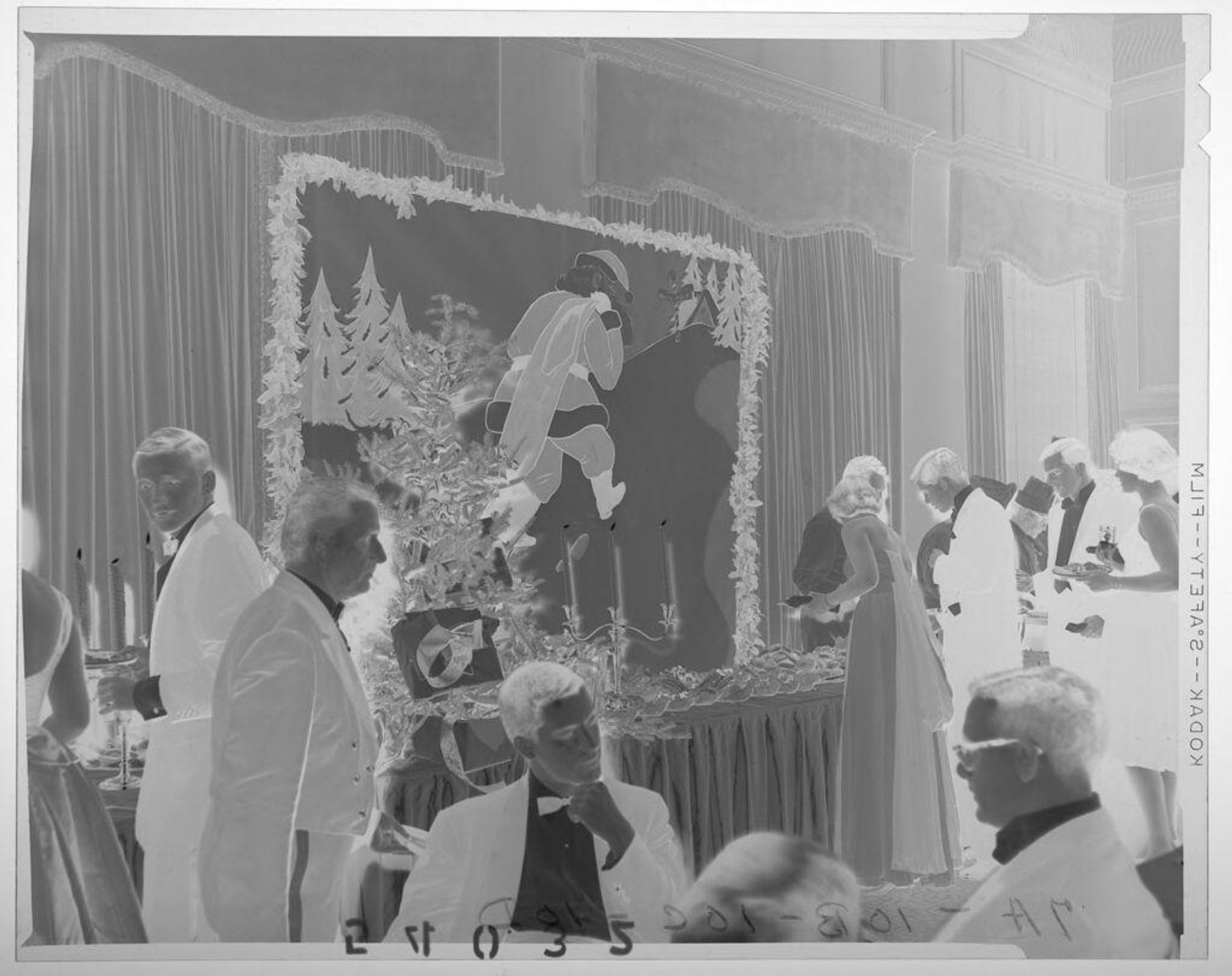 Untitled (guests chatting near food table at Christmas ball) by Martin Schweig