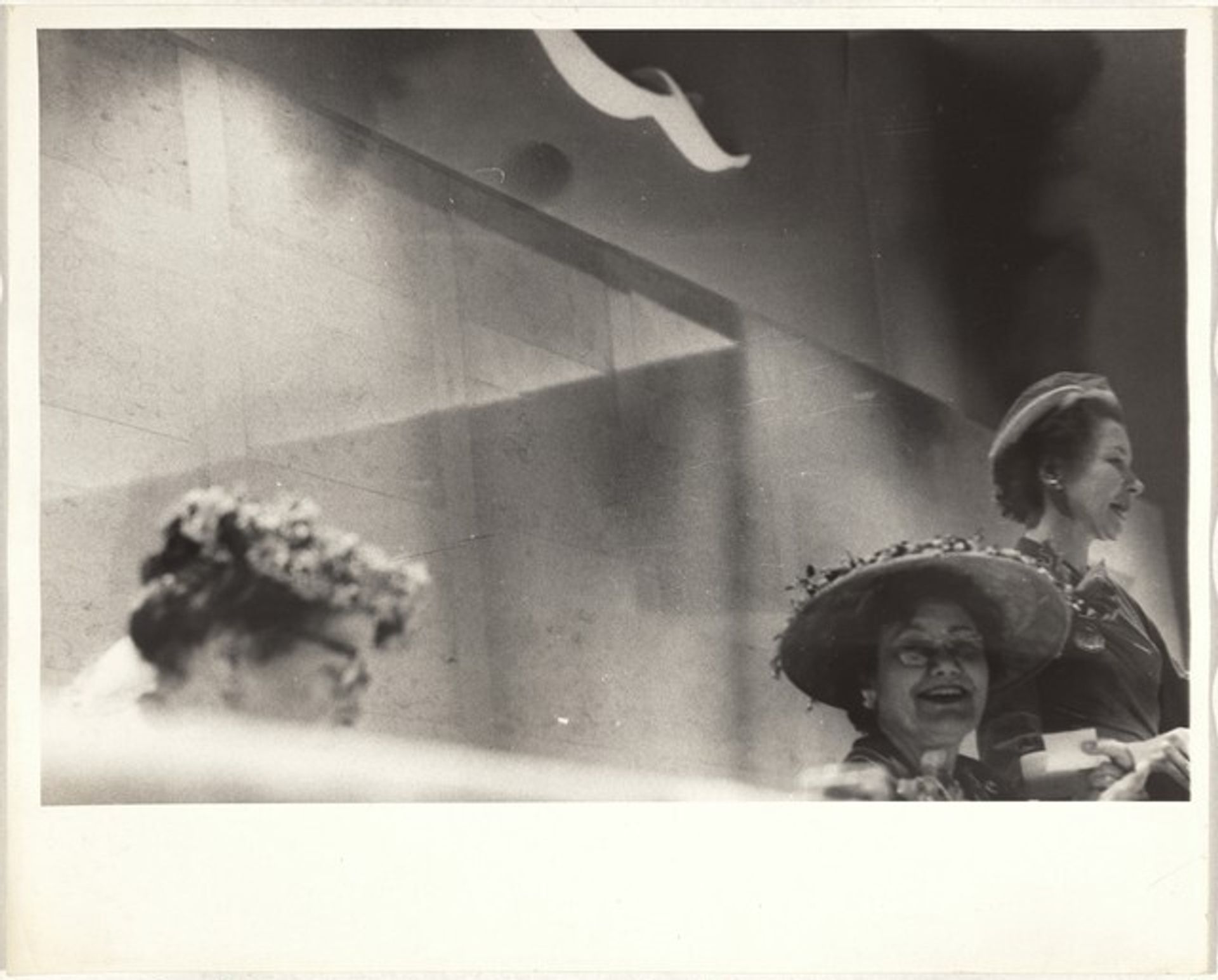 Three women in hats--Los Angeles by Robert Frank