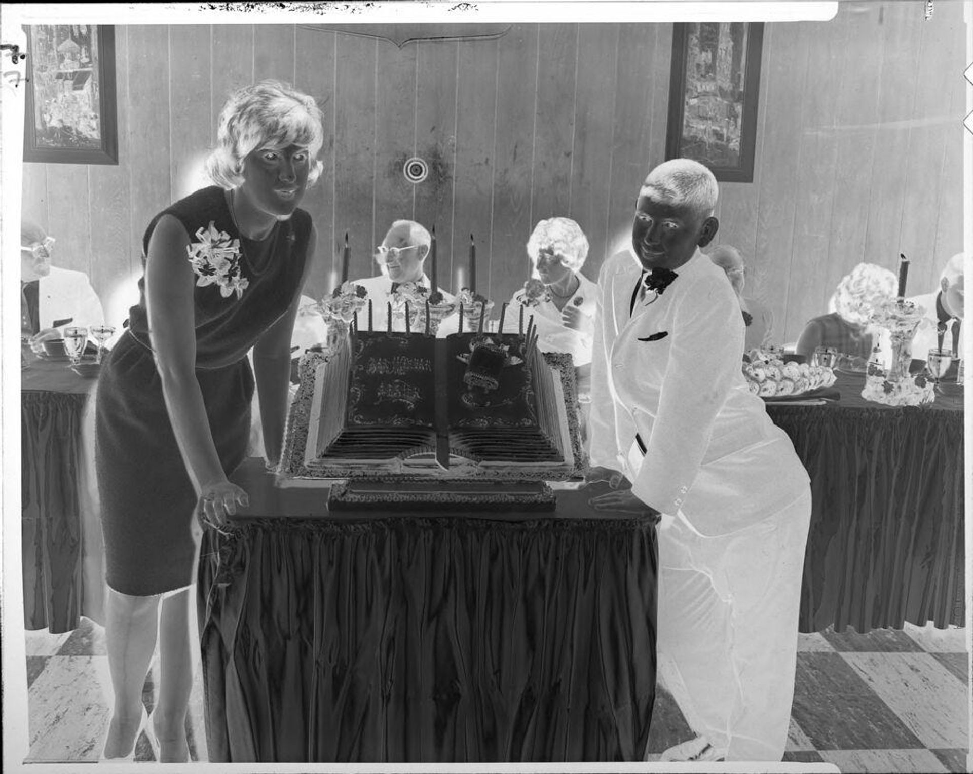 Untitled (woman and boy with bar mitzvah cake) by John Howell